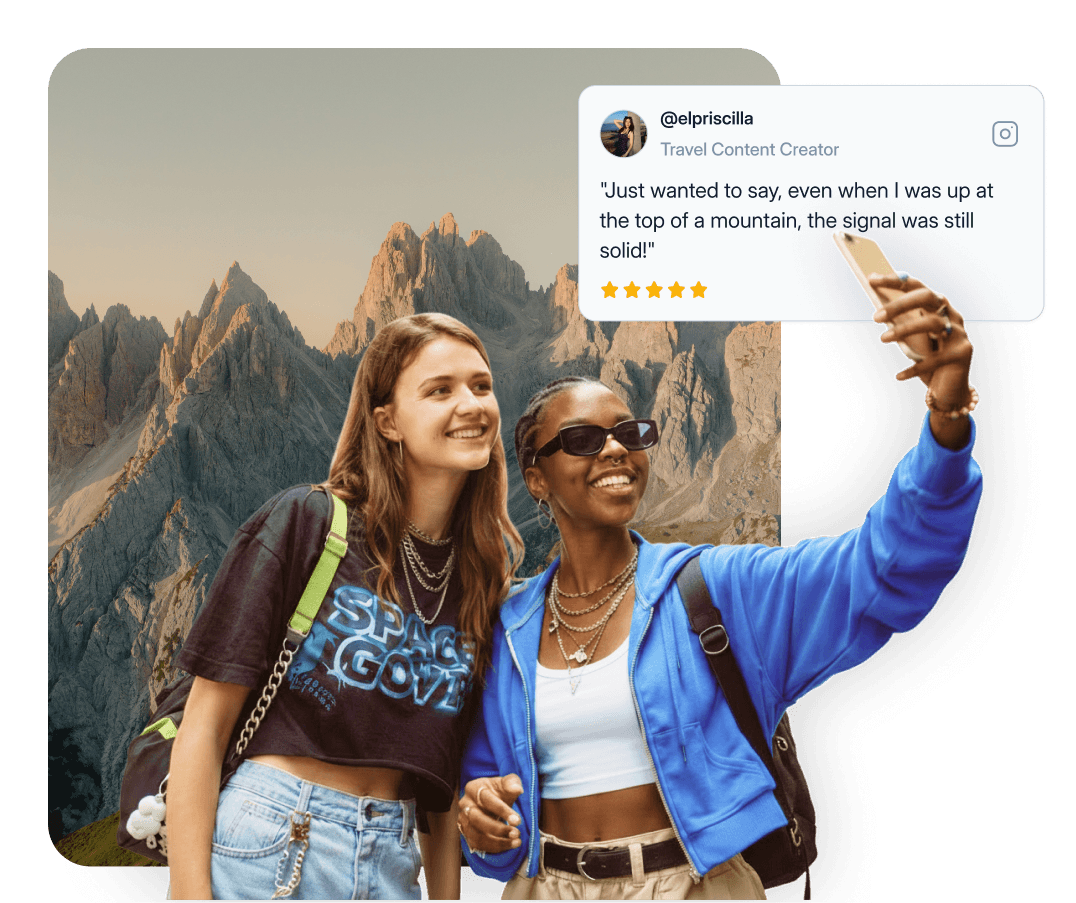 Two friends taking a selfie on a mountain, still online